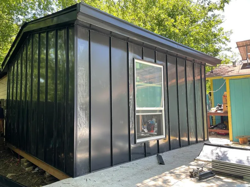 Black standing seam metal wall panels for Roof Inspection in Scottsburg